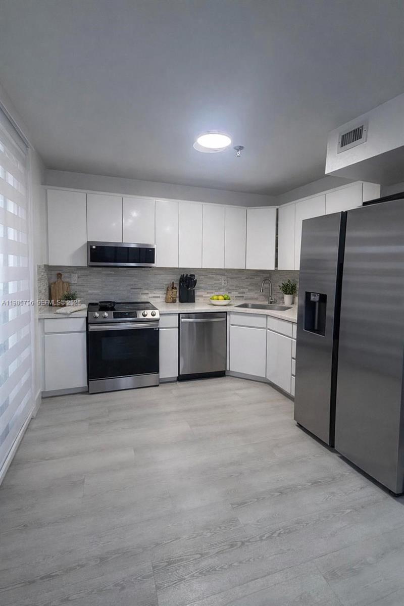 671 NE 195th St #219-E