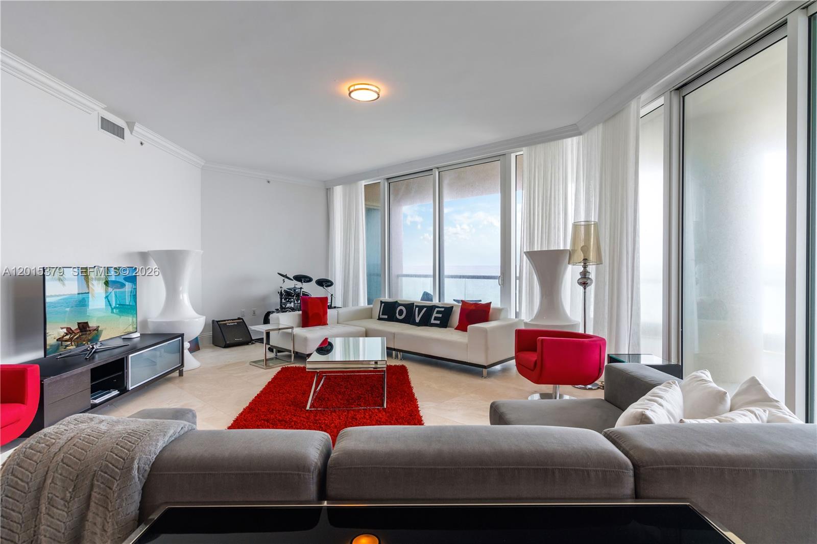 16047 Collins Ave #704